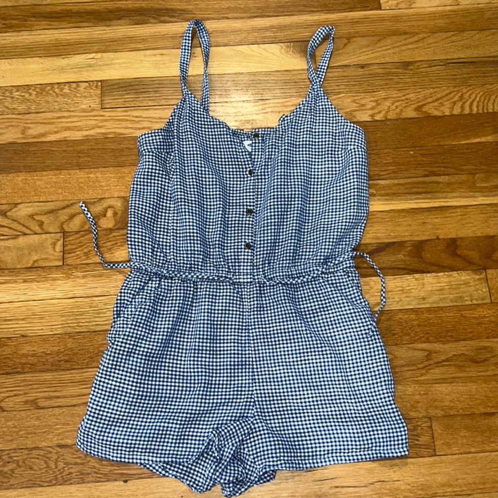 Blue and white checkered sleeveless romper.